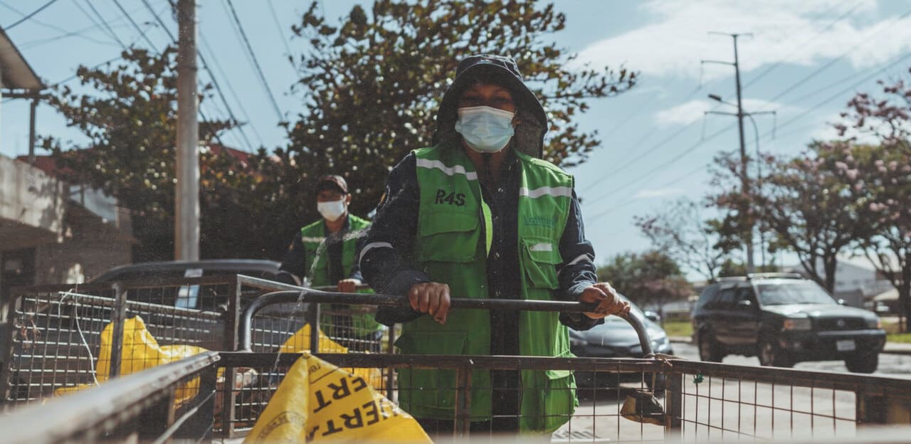worker of the recovery entity picking up plastic waste