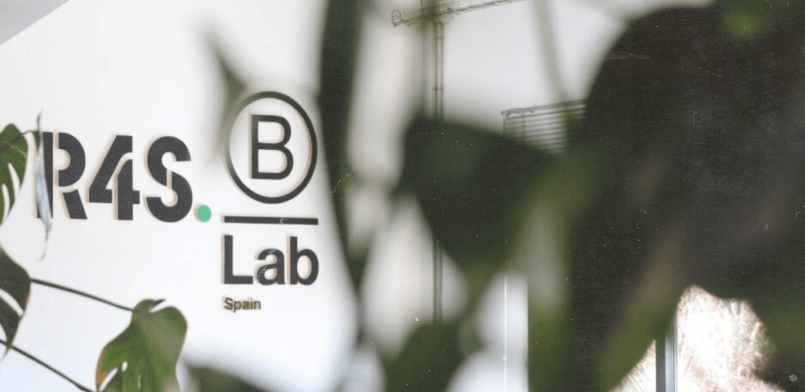 R4S group logo on the wall in their B Lab office in spain
