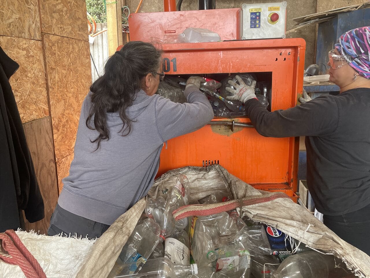 women working in the reciclador chile recovery facility, recycling plastic and verifying it with Plastiks blockchain