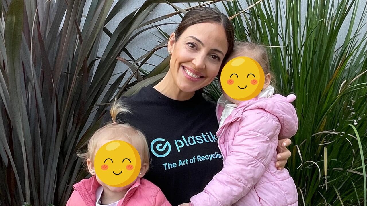 Delfina Achinelly, Head of Methodology at Plastiks, poses with her two daughters. As a sustainability leader and mother, she is committed to building a cleaner future for the next generation.
